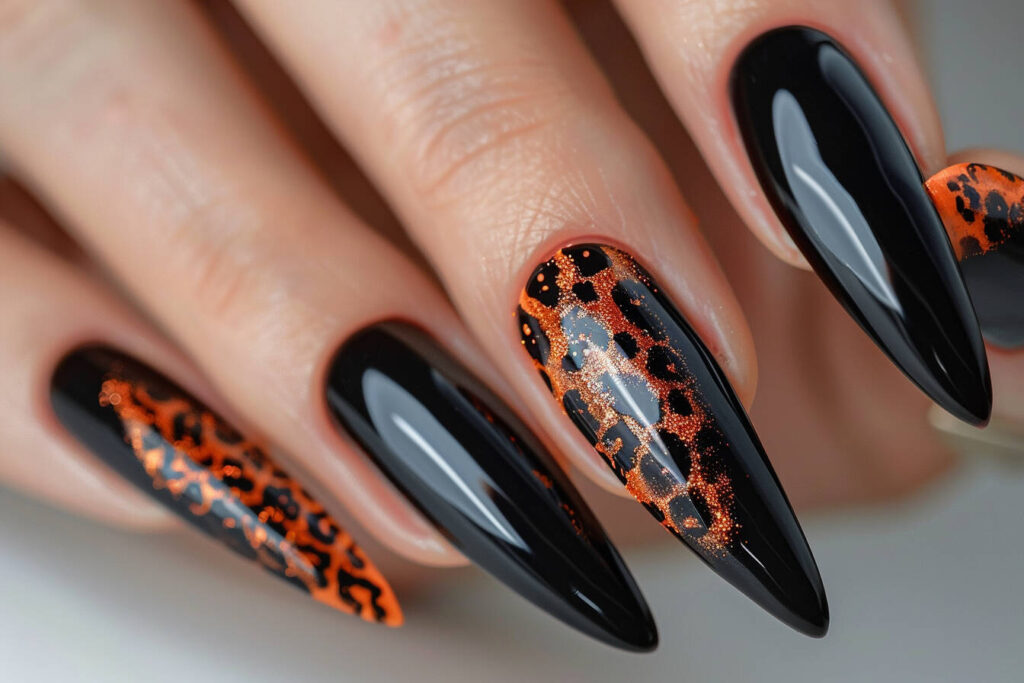black acrylic nails featuring animal print designs