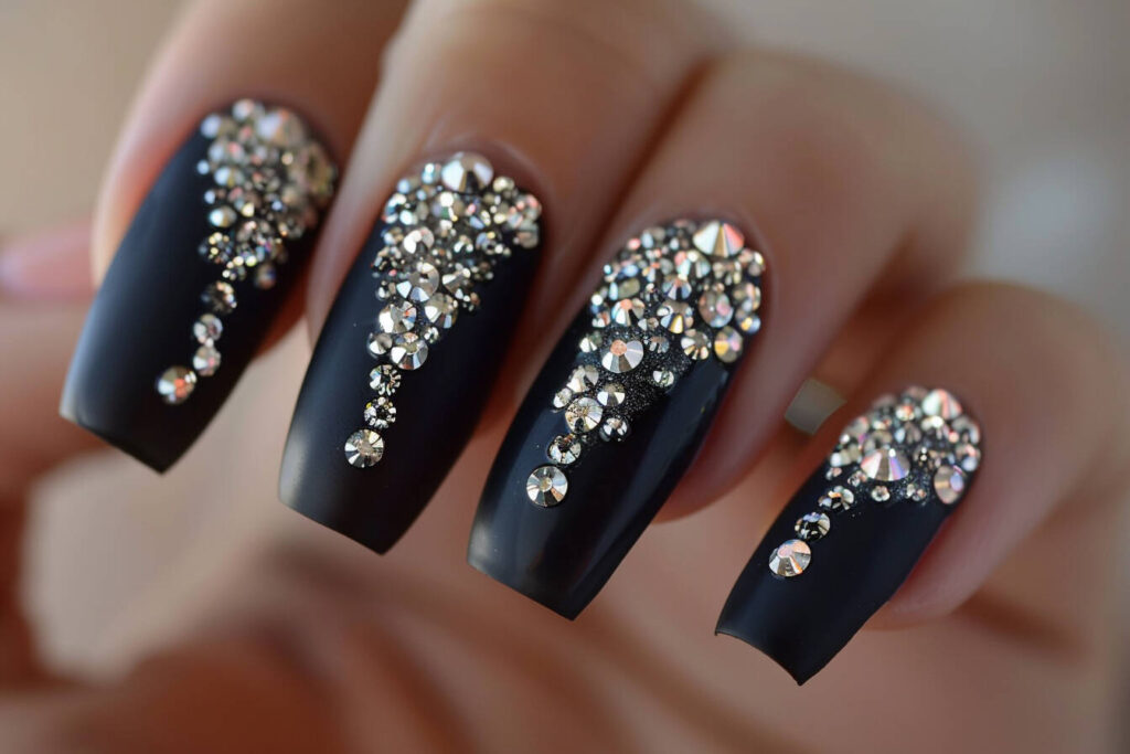black acrylic nails with sparkling rhinestone