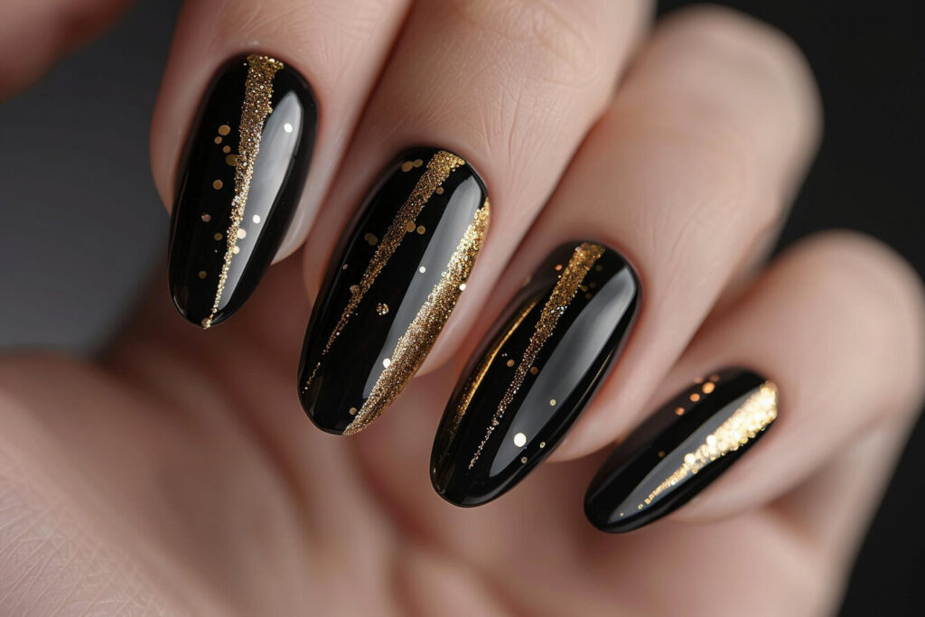 gold accents into black acrylic nails