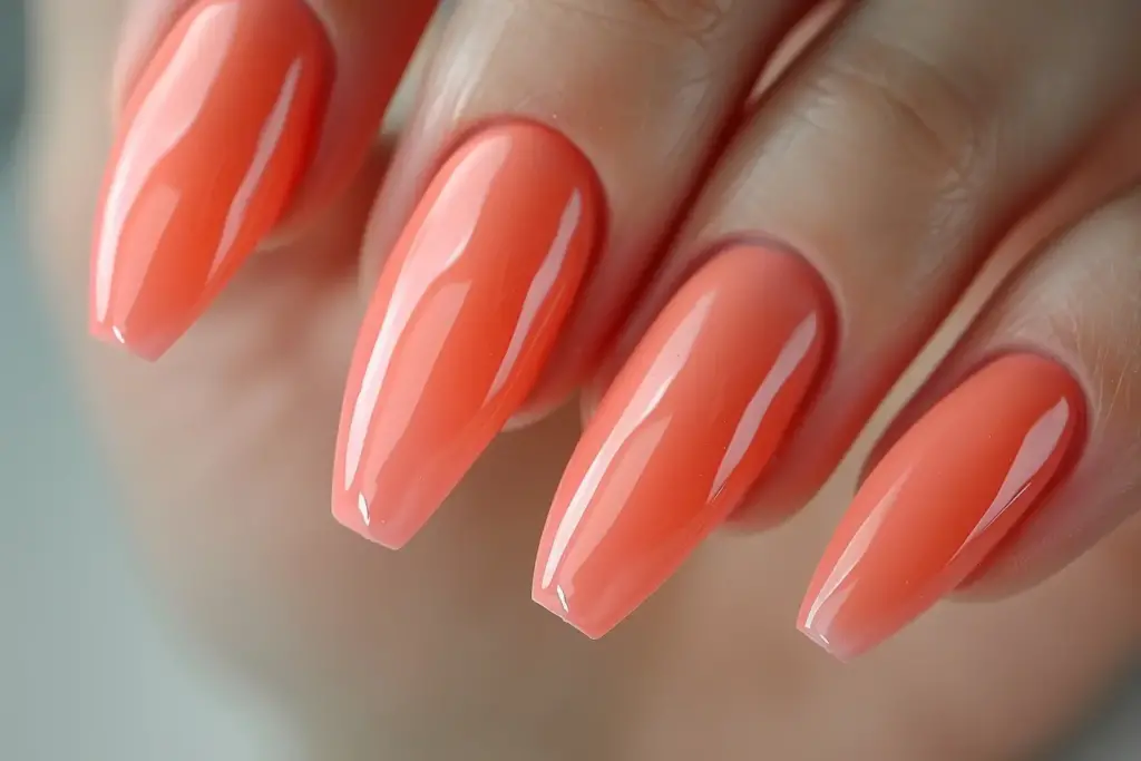 coral shade with a hint of orange nails