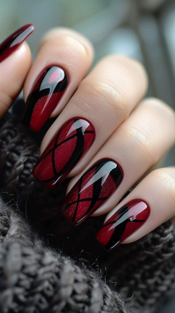 Maroon nail with Black Geometric Patterns